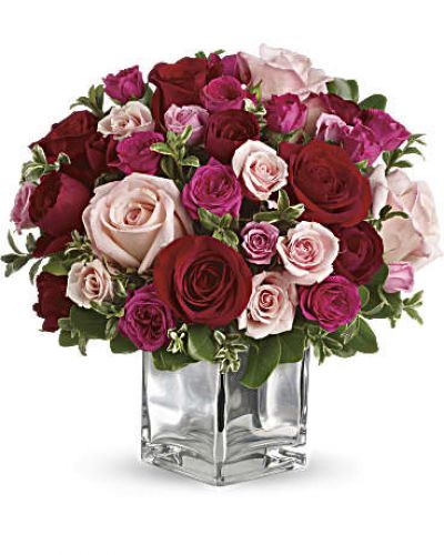 Sing them a love song - with flowers. This lush, loving rose arrangement tells them just how much you care. Colors may be substituted if not available.