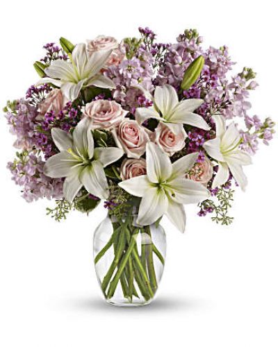 <div id="mark-3" class="m-pdp-tabs-marketing-description">Put your love into the season's most romantic flowers - light pink roses, fragrant white asiatic lilies and other favorites in a dazzling clear glass vase. Love will blossom in the most intoxicating way for a full week. You'll both enjoy it.</div>
<p> </p>
<div id="desc-3">
<ul>
<li>This spectacular bouquet includes light pink spray roses, white asiatic lilies, lavender stock and lavender waxflower accented with assorted greenery.</li>
</ul>
</div>