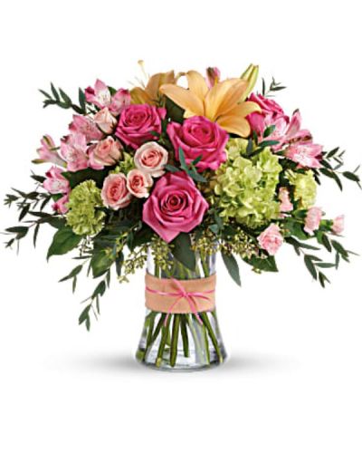 <div id="mark-3" class="m-pdp-tabs-marketing-description">Put a spring in their step with this beautifully blushing bouquet of hot pink roses, soft peach lilies and fresh green hydrangea. Arranged in a graceful vase tied with a charming bow, it's a chic treat for any occasion!</div>
<div id="desc-3">
<ul>
<li>This sweet arrangement features green hydrangea, hot pink roses, pink spray roses, peach asiatic lilies, pink alstroemeria, green carnations, pink miniature carnations, seeded eucalyptus, parvifolia eucalyptus, and lemon leaf.</li>
</ul>
</div>