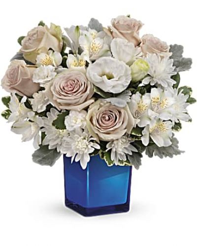 <div id="mark-3" class="m-pdp-tabs-marketing-description">Bursting with gorgeous roses and blooms, this cobalt glass cube vase is a gorgeous gift that can also serve as a beautiful candleholder!</div>
<div id="desc-3">This splendid bouquet features crème roses, white cushion spray chrysanthemums, white lisianthus, white alstroemeria, miniature white carnations, dusty miller and variegated pittosporum.</div>